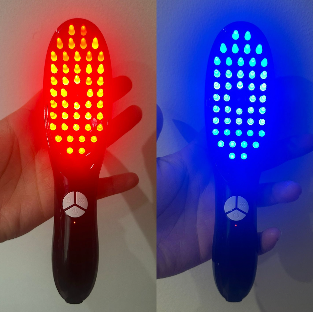 A hair brush using red and blue LED lights, paired with essential oils for an at-home hair treatment hair growth and thickness